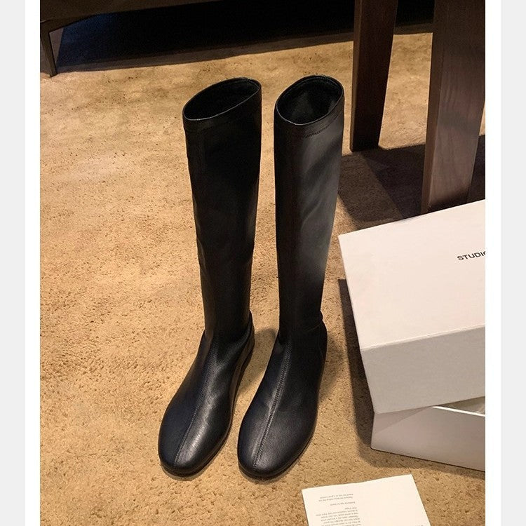 Women's Leather Knee-high Boots with a Slim Silhouette and Flat Heel